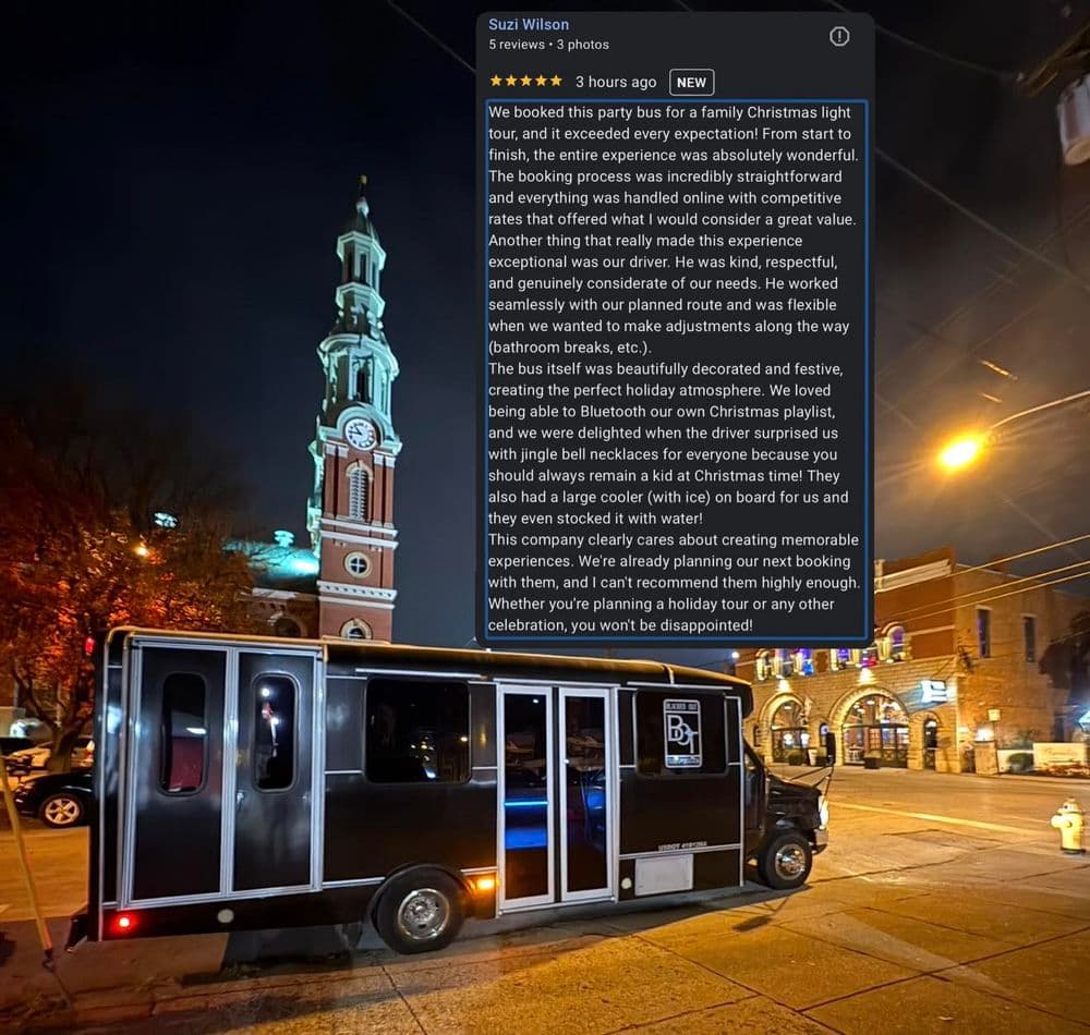 Food truck serving at a festive location with a Christmas light display and historic clock tower.