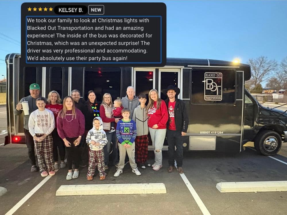 Family enjoying a festive Christmas light tour on a decorated bus with Blacked Out Transportation.